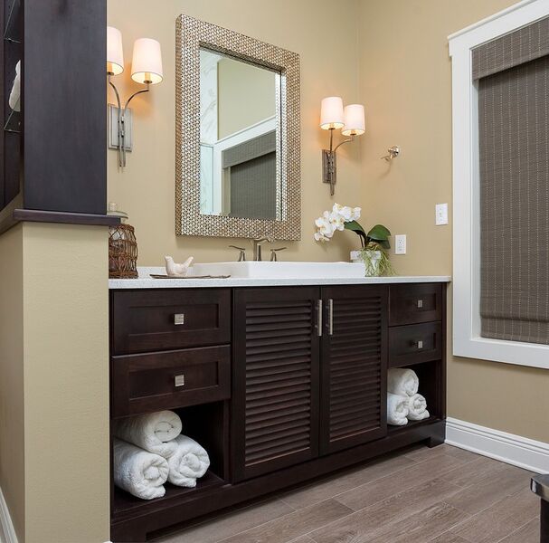Master bathroom remodel with sophisticated style: custom cabinets, dark stain, porcelain tile