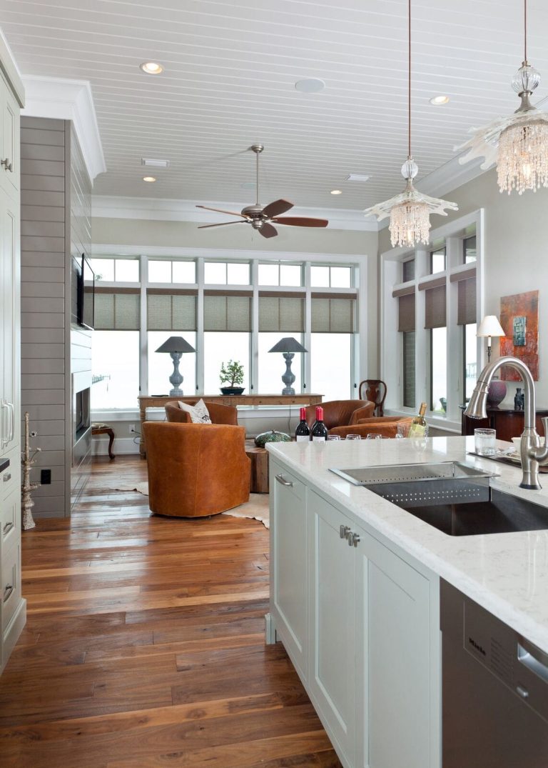 White and Blue Kitchen with Leather Chairs in Family Room