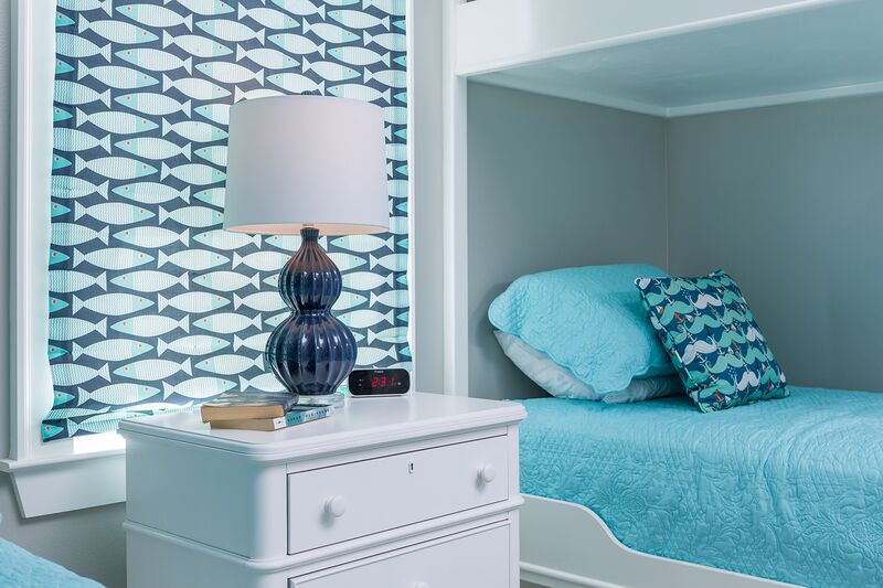 coastal blue and white bedroom with bunk beds