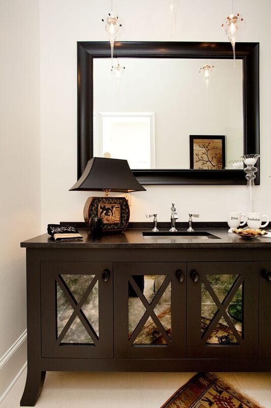 Bathroom with dark vanity and large mirror, Pensacola Florida Bath Remodel