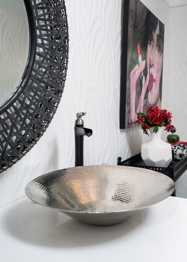 custom vanity, black mirror, black and white tile, white tile wall, original artwork Small Bath Remodel Pensacola Florida