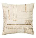 beige and brown throw pillow with beads