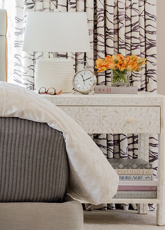 the subtle pattern on the side table is great against the bold pattern of the window treatments Kelly Rogers 3