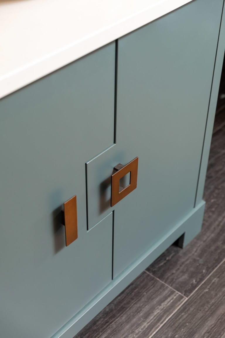 Custom vanity, powder blue cabinets with brass hardware
