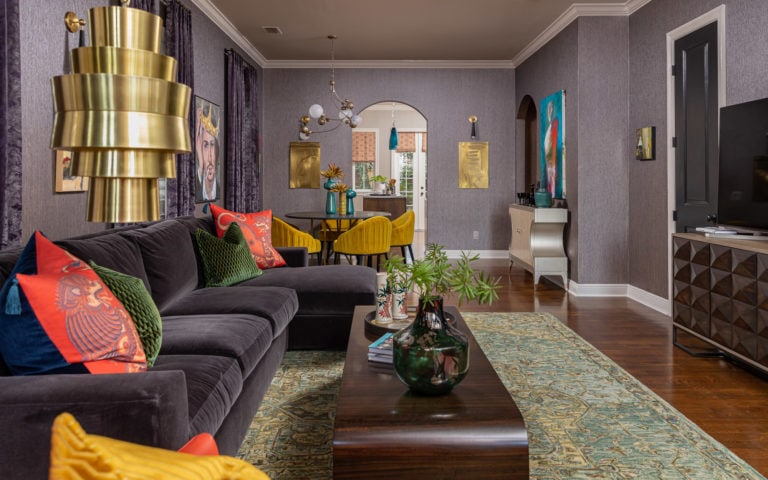 Purple Wallpaper, Purple velvet sofa, Ochre dining chairs, unique Lighting