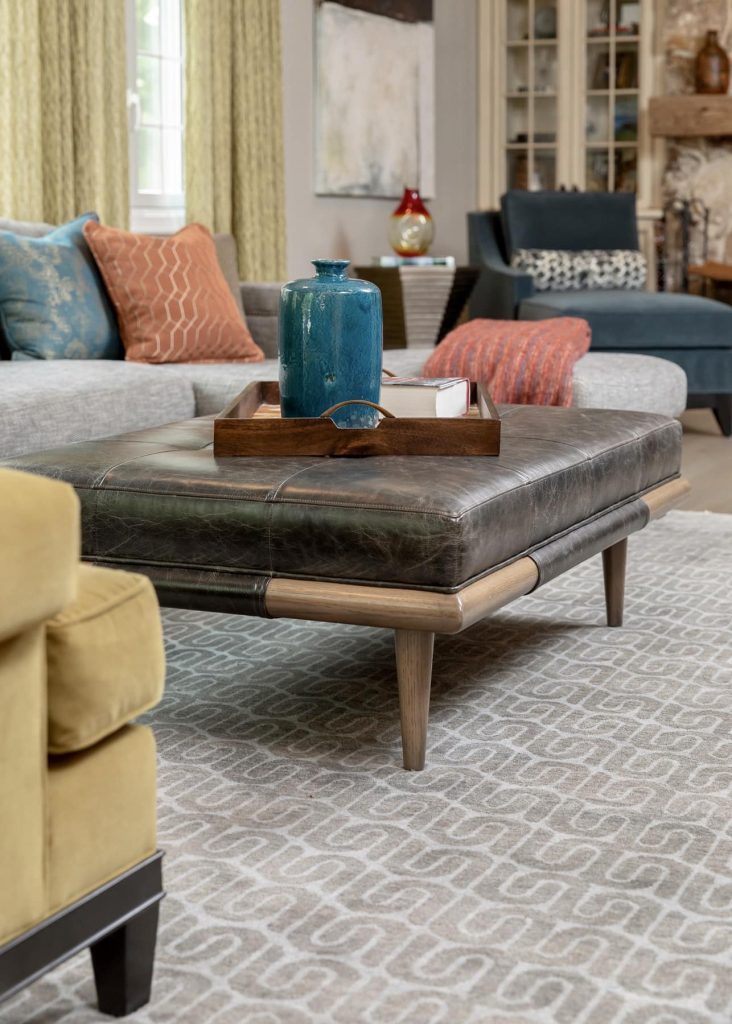 Family Room Remodel, Family Room idea, leather ottoman, blue velvet accent chair, grey sectional