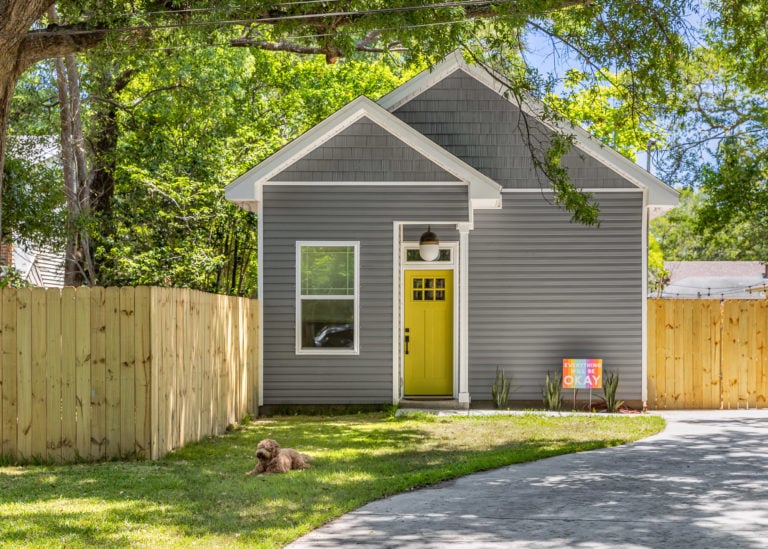 Yellow front door, Grey Tiny Home